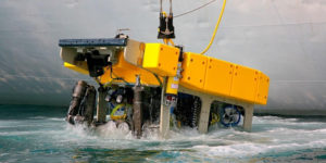 Large robotic machinery emerging from water